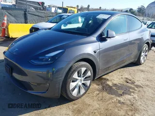 2023 Tesla Model Y Long Range with VIN 7SAYGAEE5PF964083, listed as a IAAI auction lot 41365919 with 26,008 mi miles and . Bid and sale history available at carsss.com. Image 2.
