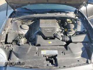 2003 Ford Thunderbird Deluxe z VIN 1FAHP60A63Y107026, wystawiony jako Copart lot #70650964 z przebiegiem 36 115 mil mil oraz Szkoda całkowita • Salvage title. Historia ofert i sprzedaży dostępna na DreamBid. Obrazek 11.