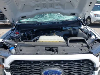 2023 Ford F-150 XL with VIN 1FTEW1CP5PKF42521, listed as a IAAI auction lot 42257062 with 30,758 mi miles and . Bid and sale history available at DreamBid. Image 10.