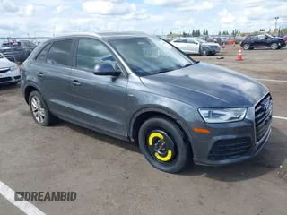 2018 Audi Q3 Premium z VIN WA1ECCFS4JR029578, wystawiony jako IAAI lot #41920030 z przebiegiem 81 508 mil mil oraz . Historia ofert i sprzedaży dostępna na DreamBid. Obrazek 1.