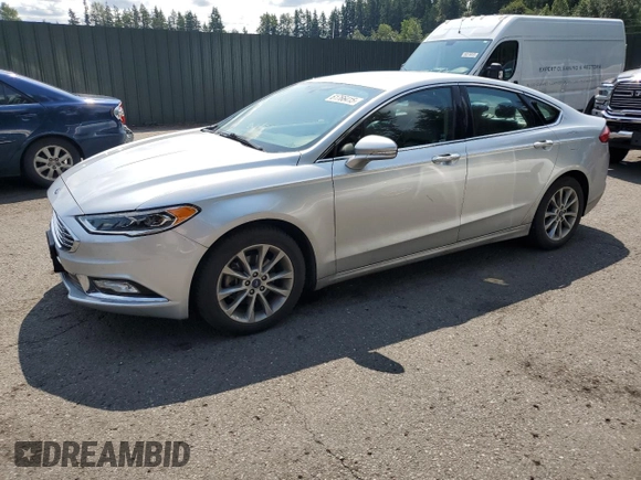 2017 Ford Fusion SE with VIN 3FA6P0HD4HR187841, listed as a Copart auction lot 61766415 with 74,303 mi miles and Salvage title. Bid and sale history available at DreamBid. Image 1.