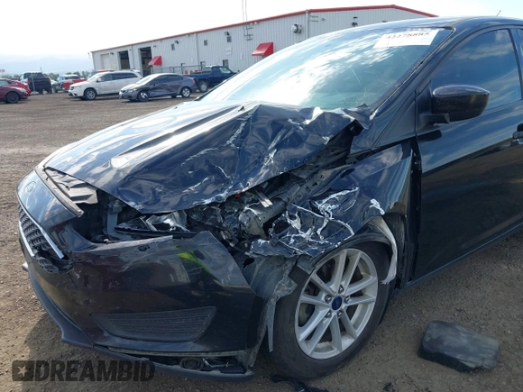 2018 Ford Focus SE z VIN 1FADP3F20JL288437, wystawiony jako IAAI lot #42278885 z przebiegiem 132 504 mil mil oraz . Historia ofert i sprzedaży dostępna na DreamBid. Obrazek 6.