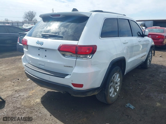 2021 Jeep Grand Cherokee Laredo X with VIN 1C4RJEAG2MC605574, listed as a IAAI auction lot 41642362 with 104,066 mi miles. Bid and sale history available at carsss.com. Image 4.