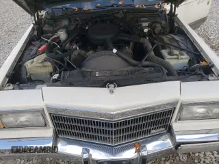 1991 Cadillac Brougham z VIN 1G6DW54E6MR710852, wystawiony jako Copart lot #76027004 z przebiegiem Nie podano mil oraz Szkody całkowita. Historia ofert i sprzedaży dostępna na DreamBid. Obrazek 11.