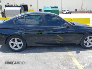 2014 BMW 3 Series 320i with VIN WBA3B1C55EK135357, listed as a IAAI auction lot 42158550 with 148,911 mi miles. Bid and sale history available at carsss.com. Image 6.