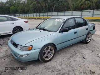 1994 Toyota Corolla Deluxe with VIN JT2AE09B6R0076080, listed as a Copart auction lot 64461545 with 244,133 mi miles and Salvage title. Bid and sale history available at DreamBid. Image 1.