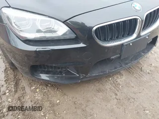 2014 BMW M6 z VIN WBSLX9C58ED160558, wystawiony jako IAAI lot #41553209 z przebiegiem 154 789 mil mil oraz . Historia ofert i sprzedaży dostępna na DreamBid. Obrazek 6.