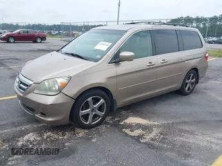 2007 Honda Odyssey Touring z VIN 5FNRL38867B076568, wystawiony jako IAAI lot #42355334 z przebiegiem 211 726 mil mil oraz . Historia ofert i sprzedaży dostępna na DreamBid. Obrazek 2.
