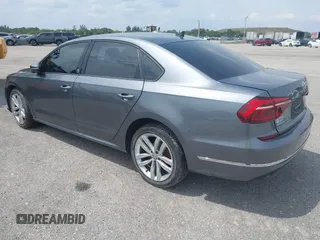 2019 Volkswagen Passat 2.0T Wolfsburg Edition with VIN 1VWLA7A35KC011084, listed as a IAAI auction lot 40385111 with 81,119 mi miles. Bid and sale history available at carsss.com. Image 3.