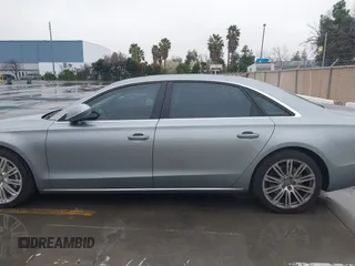 2012 Audi A8 z VIN WAURVAFD5CN008320, wystawiony jako IAAI lot #41508237 z przebiegiem 183 398 mil mil oraz . Historia ofert i sprzedaży dostępna na DreamBid. Obrazek 14.