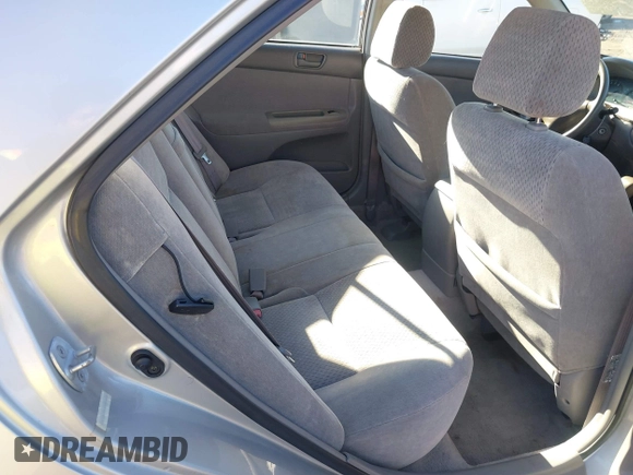 2002 Toyota Camry XLE z VIN 4T1BF30K82U506516, wystawiony jako IAAI lot #41278261 z przebiegiem 211 049 mil mil oraz . Historia ofert i sprzedaży dostępna na DreamBid. Obrazek 8.