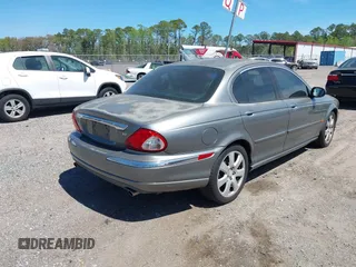 2004 Jaguar X-Type with VIN SAJEA51C04WD73023, listed as a IAAI auction lot 41874488 with 199,333 mi miles and . Bid and sale history available at DreamBid. Image 4.