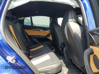 2022 BMW X4 M z VIN 5YM23EC05N9K69338, wystawiony jako Copart lot #63157463 z przebiegiem Nie podano mil oraz . Historia ofert i sprzedaży dostępna na DreamBid. Obrazek 10.