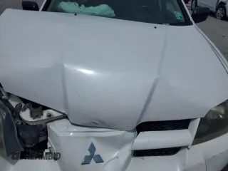 2004 Mitsubishi Outlander LS z VIN JA4LX31F44U047876, wystawiony jako Copart lot #59395585 z przebiegiem 148 726 mil mil oraz Szkoda całkowita • Salvage title. Historia ofert i sprzedaży dostępna na DreamBid. Obrazek 12.