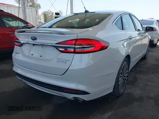 2017 Ford Fusion Hybrid Titanium with VIN 3FA6P0RU8HR229653, listed as a IAAI auction lot 42445182 with 163,279 mi miles and . Bid and sale history available at DreamBid. Image 4.