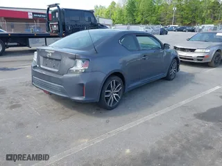 2015 Scion tC with VIN JTKJF5C71FJ013747, listed as a IAAI auction lot 42087740 with 138,097 mi miles. Bid and sale history available at carsss.com. Image 4.