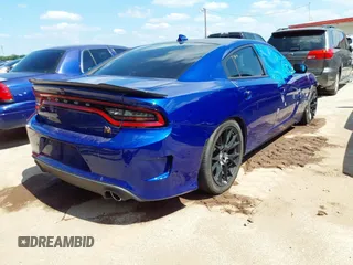 2019 Dodge Charger Scat Pack with VIN 2C3CDXGJ8KH588905, listed as a IAAI auction lot 42211811 with 50,298 mi miles and . Bid and sale history available at carsss.com. Image 4.