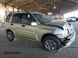 1999 Suzuki Grand Vitara LX z VIN JS3TD62V3X4123048, wystawiony jako Copart lot #73007124 z przebiegiem 159 828 mil mil oraz Szkoda całkowita • Salvage title. Historia ofert i sprzedaży dostępna na DreamBid. Obrazek 4.