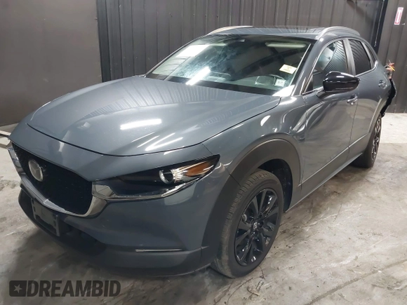 2022 Mazda CX-30 S Carbon Edition with VIN 3MVDMBCL8NM447234, listed as a IAAI auction lot 42511600 with 51,926 mi miles and . Bid and sale history available at DreamBid. Image 2.