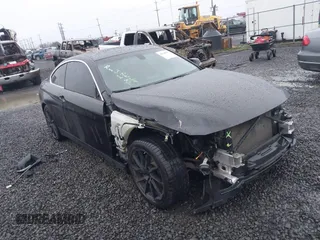 2015 BMW 4 Series 428i xDrive with VIN WBA3N5C56FK197981, listed as a IAAI auction lot 41145927 with 101,944 mi miles. Bid and sale history available at carsss.com. Image 1.