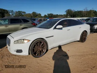 2013 Jaguar XJ with VIN SAJWA1C7XD8V42463, listed as a Copart auction lot 82557554 with 136,081 mi miles and Clean Title. Bid and sale history available at DreamBid. Image 1.