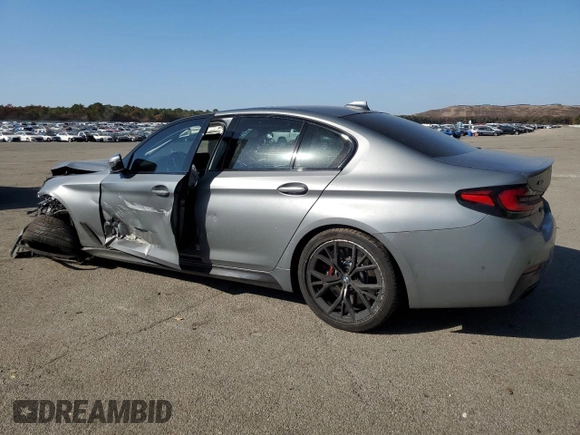 2023 BMW 5 Series M550i xDrive with VIN WBA13BK09PCN61839, listed as a Copart auction lot 76614694 with 16,279 mi miles and Salvage title. Bid and sale history available at DreamBid. Image 2.