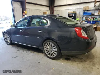 2013 Lincoln MKS with VIN 1LNHL9DK6DG613985, listed as a Copart auction lot 48672465 with 102218 miles and Salvage Title. Bid and sale history available at carsss.com. Image 2.