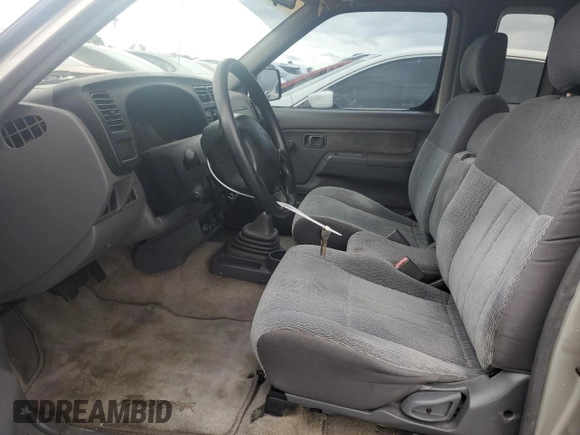 2000 Nissan Frontier XE with VIN 1N6DD26S6YC415423, listed as a Copart auction lot 59086535 with 122,746 mi miles and Salvage title. Bid and sale history available at DreamBid. Image 7.