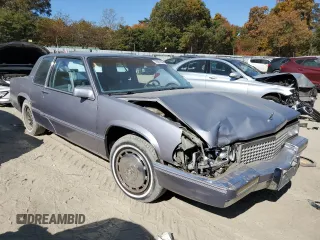 1990 Cadillac DeVille z VIN 1G6CD1339L4358825, wystawiony jako Copart lot #76901884 z przebiegiem 169 956 mil mil oraz Szkoda całkowita • Salvage title. Historia ofert i sprzedaży dostępna na DreamBid. Obrazek 4.