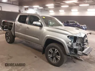 2019 Toyota Tacoma SR z VIN 3TMCZ5AN1KM256173, wystawiony jako IAAI lot #42060064 z przebiegiem 38 082 mil mil oraz . Historia ofert i sprzedaży dostępna na DreamBid. Obrazek 1.