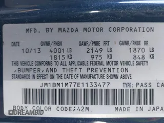 2014 Mazda 3 i Grand Touring with VIN JM1BM1M77E1133477, listed as a IAAI auction lot 41861051 with 124,377 mi miles and . Bid and sale history available at DreamBid. Image 9.