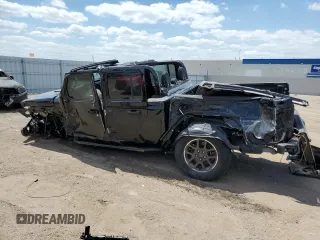 2021 Jeep Gladiator 80th Anniversary с VIN 1C6HJTAG2ML513632, выставлен на аукционе Copart как лот 57140595 с пробегом Не указан миль и Списание • Salvage title. История ставок и продаж доступна на DreamBid. Изображение 2.