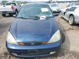2003 Ford Focus ZX3 with VIN 3FAFP31313R104703, listed as a IAAI auction lot 42487996 with 91,526 mi miles and . Bid and sale history available at DreamBid. Image 6.