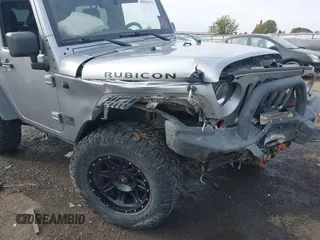 2013 Jeep Wrangler Rubicon 10th Anniversary with VIN 1C4BJWCG8DL639121, listed as a IAAI auction lot 40561773 with 56,023 mi miles and . Bid and sale history available at DreamBid. Image 6.