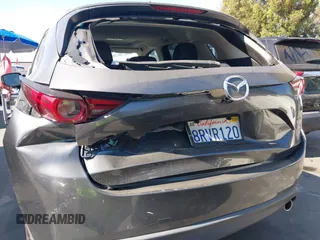 2020 Mazda CX-5 Grand Touring with VIN JM3KFADM3L1812649, listed as a IAAI auction lot 42575393 with 102,118 mi miles and . Bid and sale history available at DreamBid. Image 6.