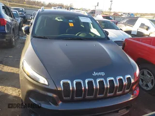 2016 Jeep Cherokee Altitude with VIN 1C4PJLCS8GW173279, listed as a IAAI auction lot 41129117 with 163,978 mi miles. Bid and sale history available at carsss.com. Image 12.