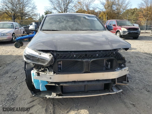 2021 BMW X2 xDrive28i with VIN WBXYJ1C07M5S21169, listed as a Copart auction lot 77829574 with 24,173 mi miles and Salvage Title. Bid and sale history available at carsss.com. Image 5.