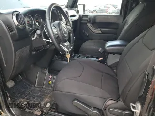 2014 Jeep Wrangler Sport with VIN 1C4AJWAG1EL200181, listed as a Copart auction lot 61165595 with 101,234 mi miles and Salvage title. Bid and sale history available at DreamBid. Image 7.