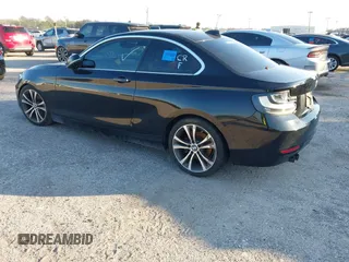2015 BMW 2 Series 228i with VIN WBA1F5C58FV257021, listed as a IAAI auction lot 41318026 with 154,906 mi miles. Bid and sale history available at carsss.com. Image 3.