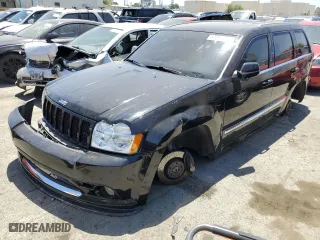 2007 Jeep Grand Cherokee SRT-8 with VIN 1J8HR78387C603473, listed as a Copart auction lot 57712964 with 114,429 mi miles and Salvage Title. Bid and sale history available at carsss.com. Image 1.