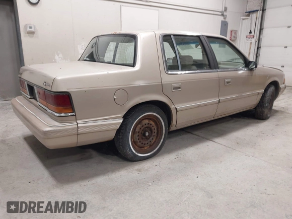 1991 Dodge Spirit z VIN 1B3XA46KXMF519542, wystawiony jako IAAI lot #42278204 z przebiegiem 134 919 mil mil oraz . Historia ofert i sprzedaży dostępna na DreamBid. Obrazek 4.