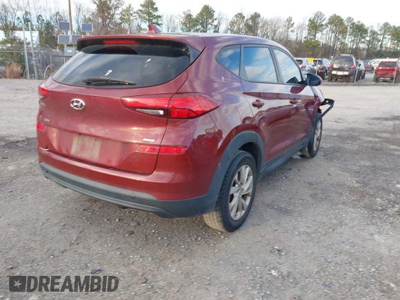 2019 Hyundai Tucson SE with VIN KM8J2CA49KU881841, listed as a IAAI auction lot 41099575 with 129,153 mi miles. Bid and sale history available at carsss.com. Image 4.