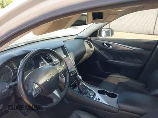 2015 Infiniti Q50 Premium z VIN JN1BV7AP1FM346254, wystawiony jako IAAI lot #42147947 z przebiegiem 147 737 mil mil oraz . Historia ofert i sprzedaży dostępna na DreamBid. Obrazek 5.