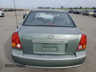 2004 Hyundai Accent GL with VIN KMHCG45C14U540938, listed as a Copart auction lot 46701935 with 71,891 mi miles and Salvage Title. Bid and sale history available at carsss.com. Image 6.