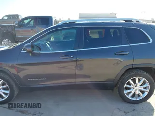 2016 Jeep Cherokee Limited with VIN 1C4PJLDS7GW159825, listed as a IAAI auction lot 41951609 with 102,624 mi miles and . Bid and sale history available at DreamBid. Image 14.