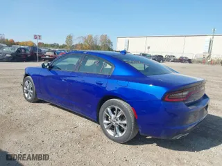 2021 Dodge Charger SXT with VIN 2C3CDXJG0MH601422, listed as a IAAI auction lot 40644896 with 64,836 mi miles. Bid and sale history available at carsss.com. Image 3.