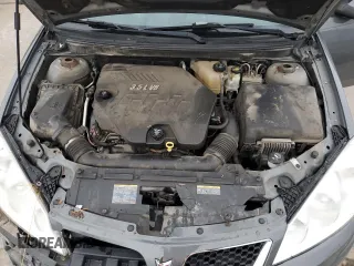 2009 Pontiac G6 GT 1SB z VIN 1G2ZK57K994246920, wystawiony jako Copart lot #85570504 z przebiegiem 127 048 mil mil oraz Czysty tytuł • Clean title. Historia ofert i sprzedaży dostępna na DreamBid. Obrazek 12.