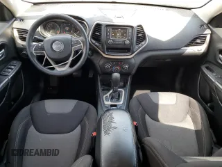 2014 Jeep Cherokee Sport with VIN 1C4PJLAB6EW212564, listed as a Copart auction lot 54355115 with 138,401 mi miles and Salvage Title. Bid and sale history available at DreamBid. Image 8.