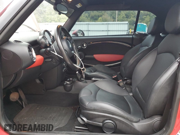 2011 MINI Convertible with VIN WMWZN3C51BTZ78331, listed as a Copart auction lot 73348304 with 94,219 mi miles and Salvage title. Bid and sale history available at DreamBid. Image 7.