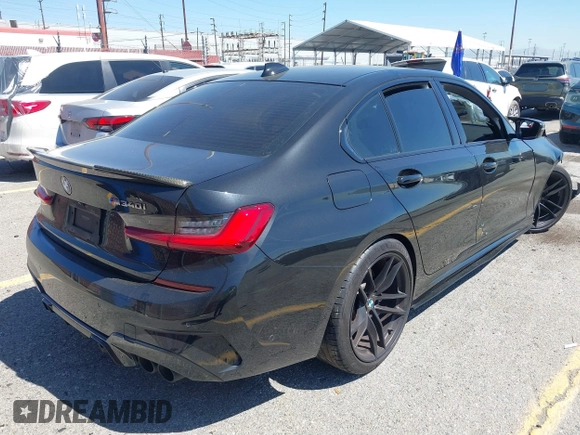 2020 BMW 3 Series M340i with VIN WBA5U7C04LFH33037, listed as a IAAI auction lot 41872419 with 68,065 mi miles. Bid and sale history available at carsss.com. Image 4.